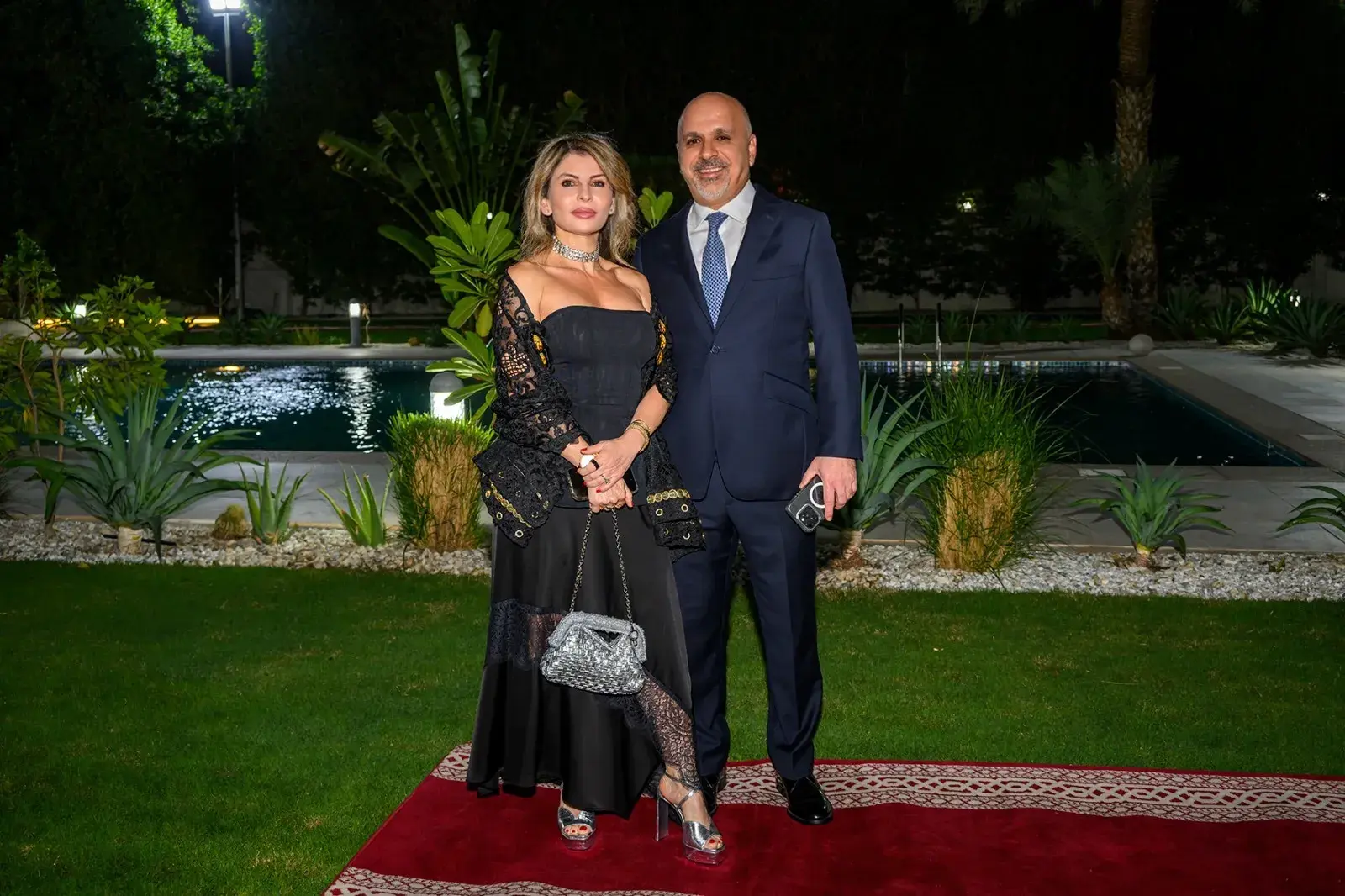 Rula Qassir Lolas with her husband outdoors — رولا قصير لولس